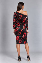 A woman modeling a black off-the-shoulder midi dress with a red and white floral print, shown from the back against a gray studio background.