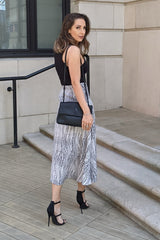 EDEN BLACK & WHITE POLKA DOT MIDI SKIRT WITH AN ASYMMETRICAL HEMLINE