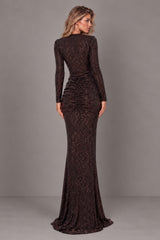 A woman modeling a long-sleeve, floor-length dark brown sequined bodysuit and skirt, set against a solid gray studio background.