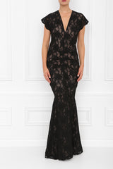 A maxi dress with black lace fabric, featuring cap sleeves and a pleated front, with an invisible zip and nude underline.