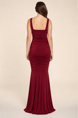 Burgundy berry evening gown on a plain background